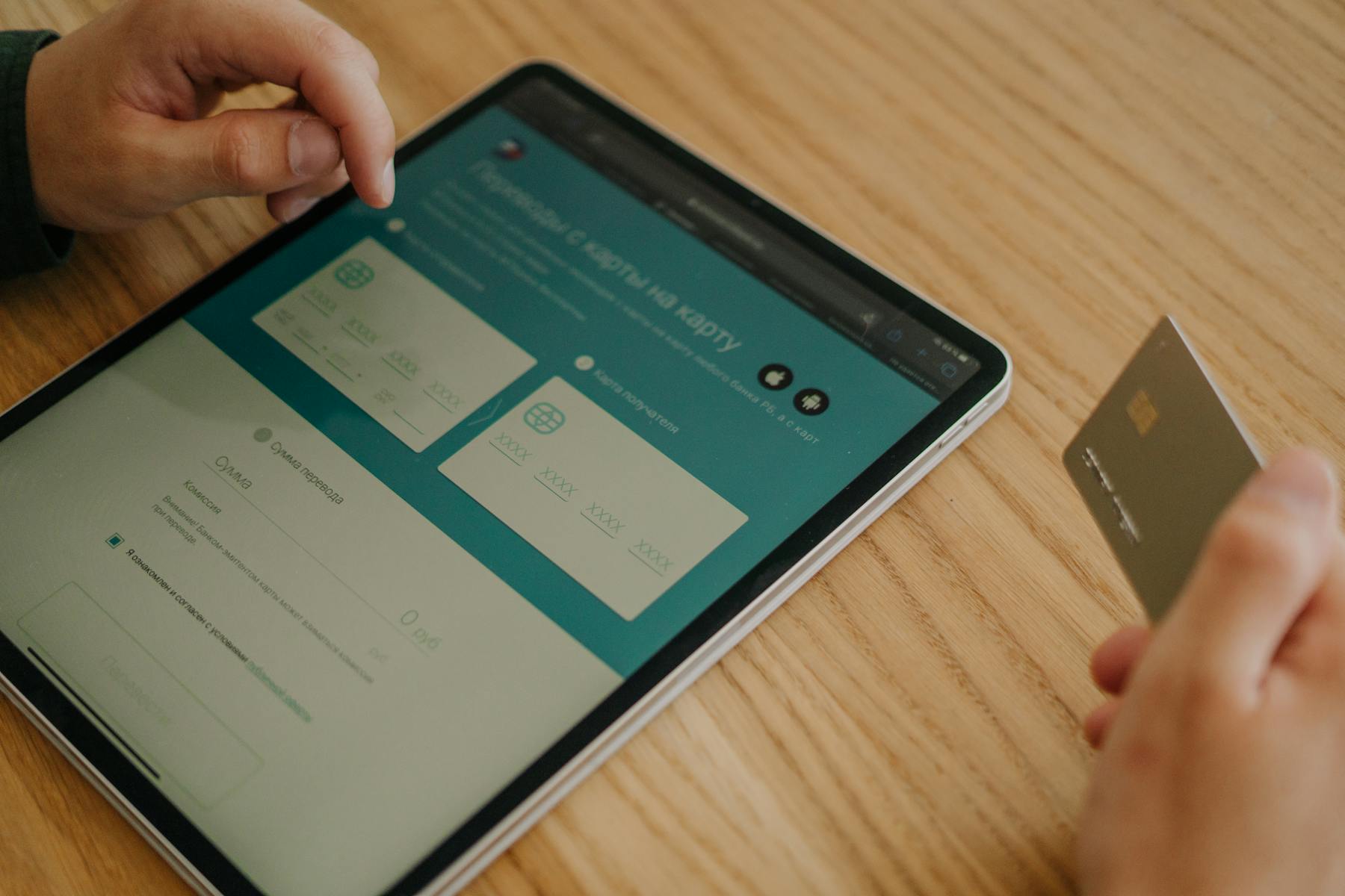 A merchant uses a smartphone and card reader to process a card payment.